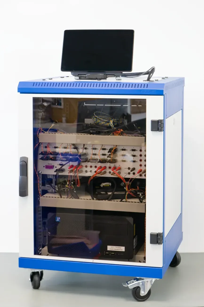 Automotive HMI test rack with a mounted display, connection panels and wiring