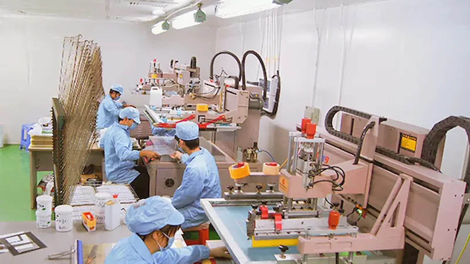 Graphic overlay production in a controlled workshop