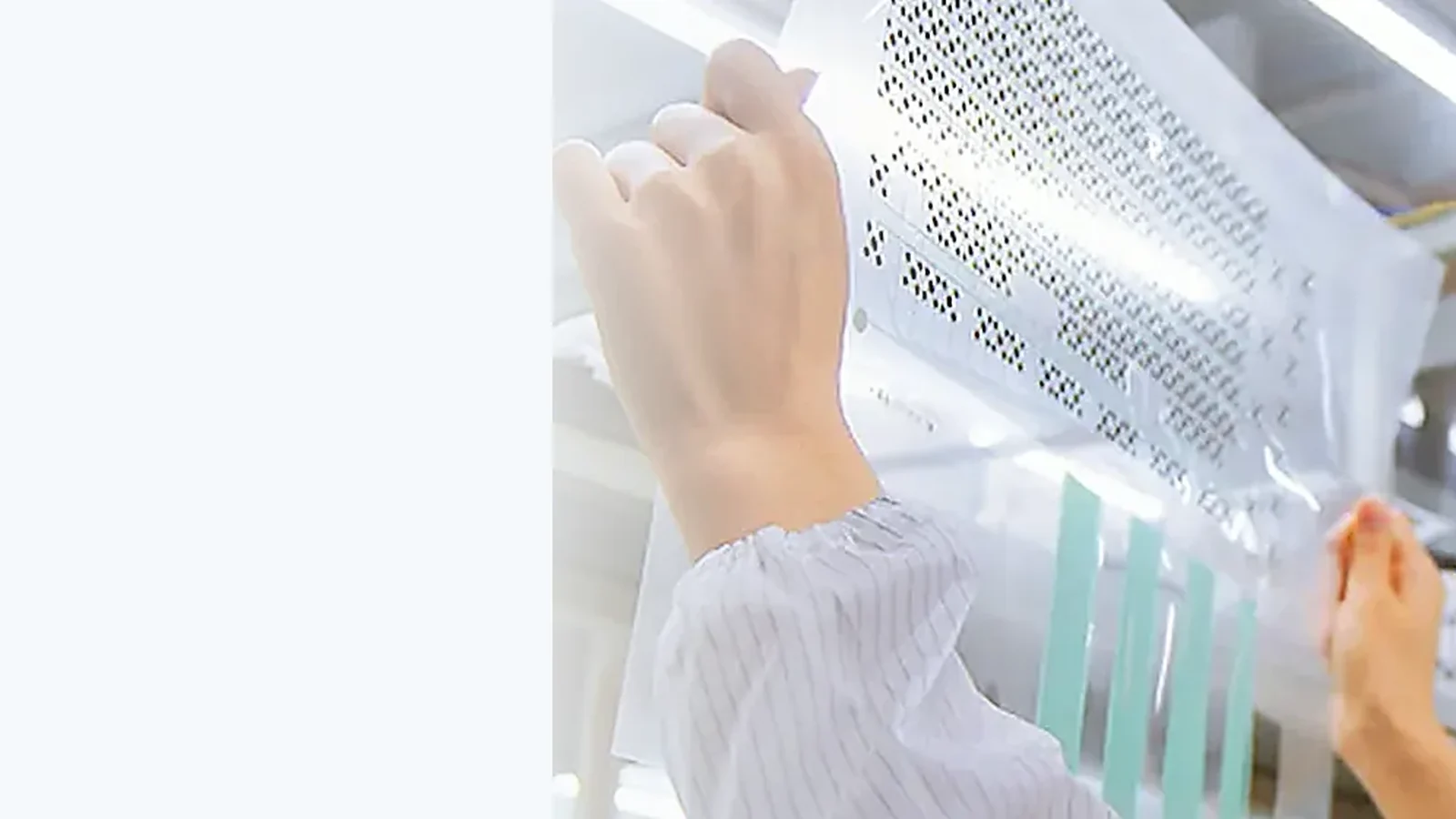 Operator inspecting printed overlay film