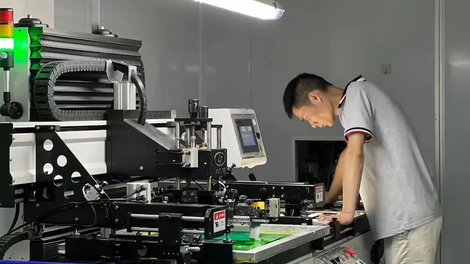Factory screen printing of graphic overlay sheets