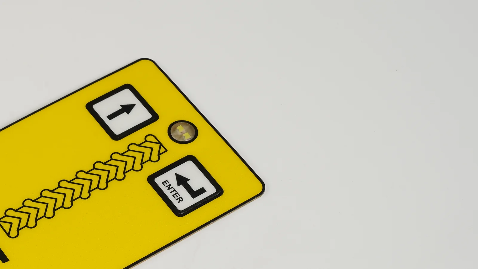Real metal dome membrane switch detail with compact tactile buttons and a status indicator