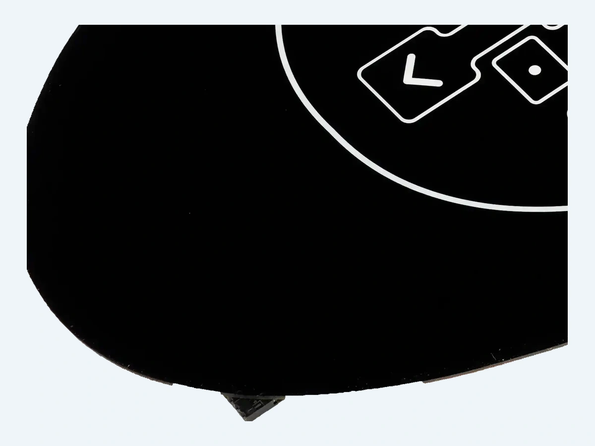 Curved faceplate outline, printed border and operating symbols shown in close-up