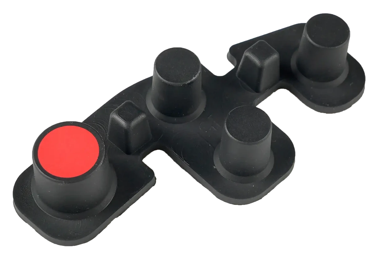Close-up of raised round and shaped buttons on a black molded keypad