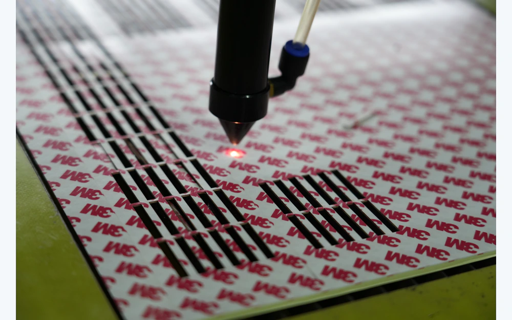 Laser registration and converting of repeated flexible sensor components on release liner