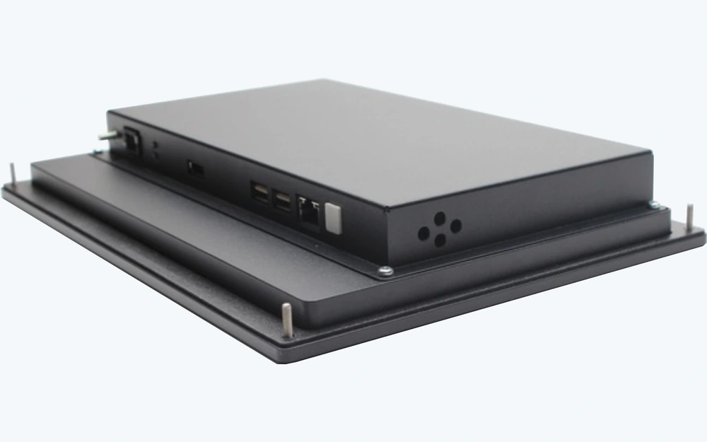 Real rear-mounted HMI computer module with enclosure flange, mounting studs, and interface ports