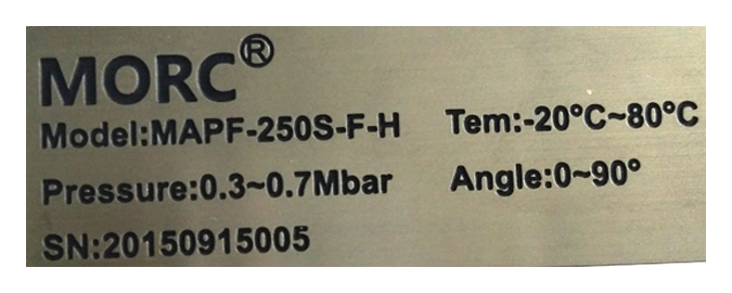 Close-up of the original model and serial identification on an equipment nameplate