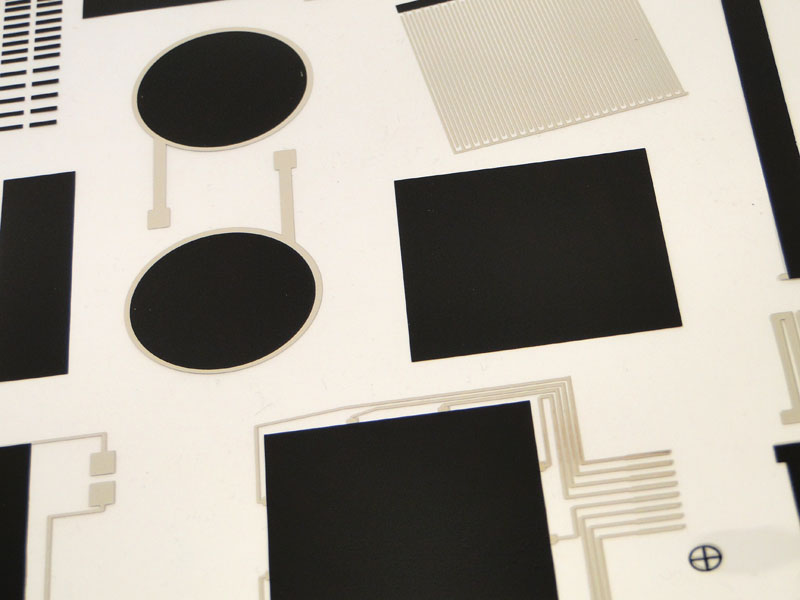 Printed sensor sheet with black sensing patches, electrodes and connection traces