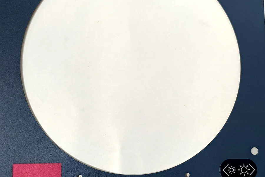 Appliance control overlay with circular display opening