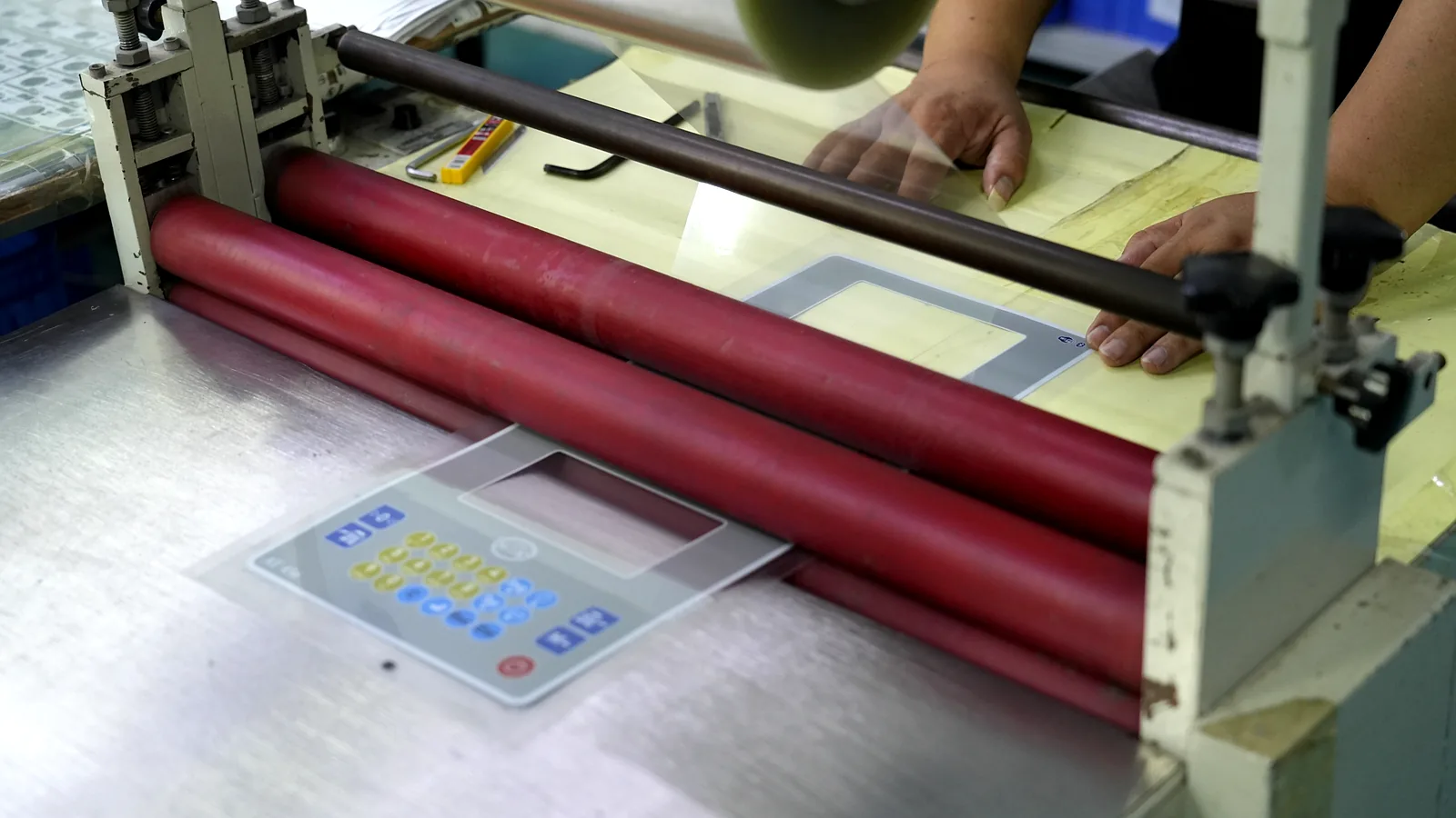 Factory lamination assembly for a graphic overlay