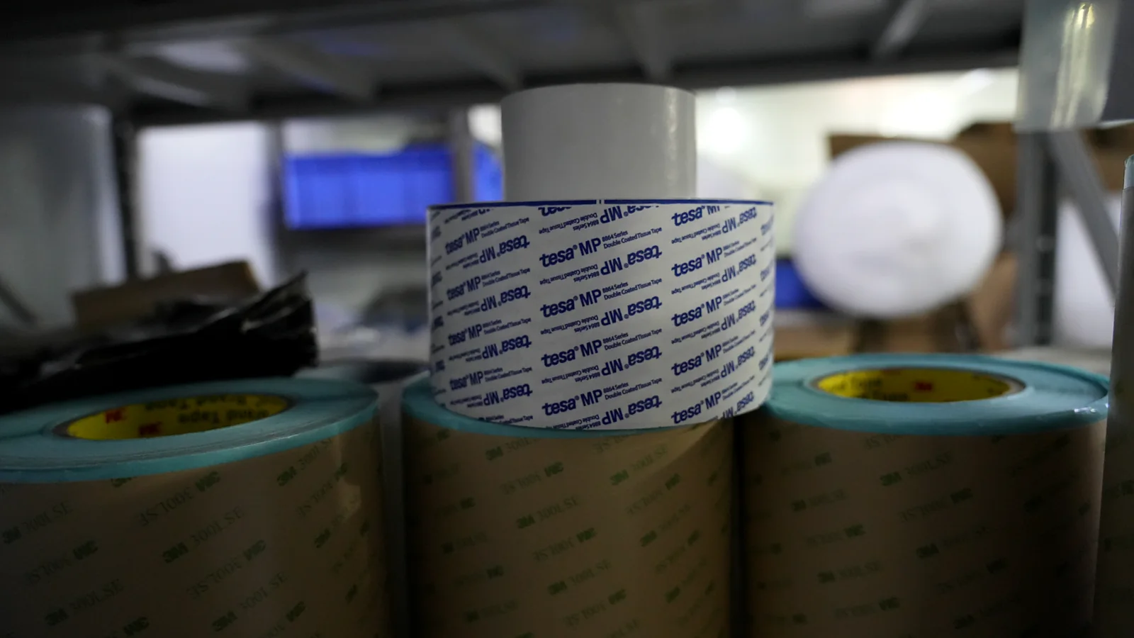 Pressure-sensitive adhesive rolls stored for membrane switch layer conversion