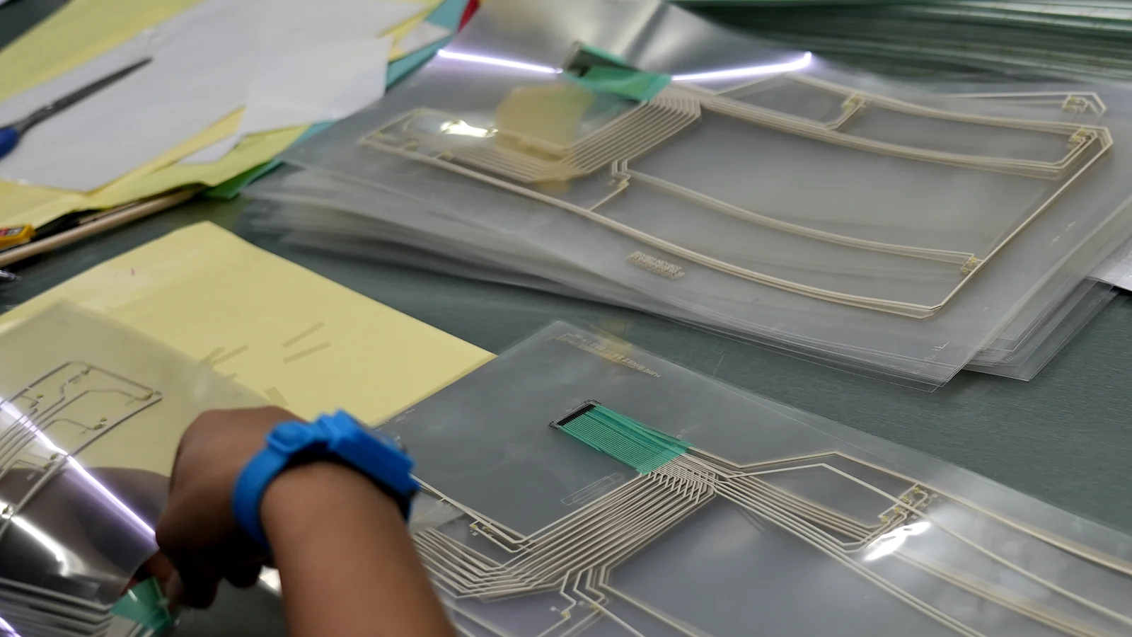 JASPER factory laminating adhesive layers for industrial HMI front panels